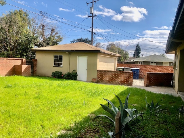 exterior space with an outdoor structure and fence