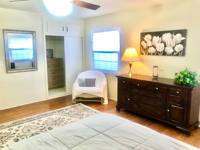 bedroom with a ceiling fan and wood finished floors