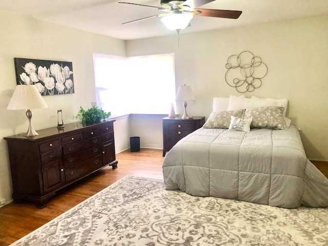 bedroom featuring a ceiling fan and wood finished floors