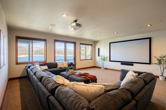 home theater room featuring recessed lighting, baseboards, and light colored carpet