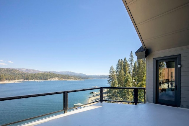 balcony with a water and mountain view