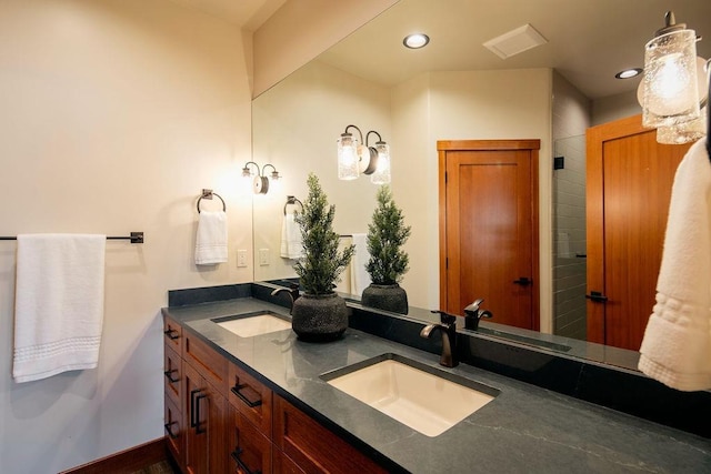 bathroom with a sink and recessed lighting