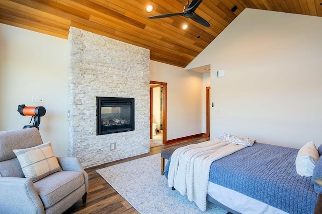 bedroom with high vaulted ceiling, wooden ceiling, a fireplace, and wood finished floors