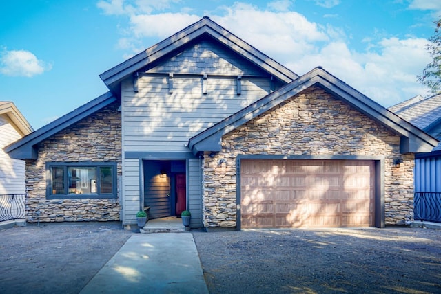 craftsman-style home featuring a garage and driveway