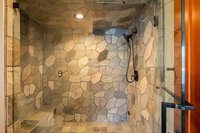 bathroom featuring a tile shower