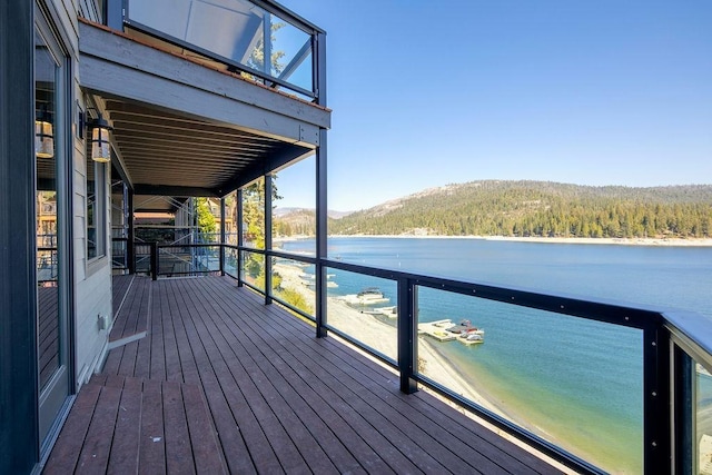 deck featuring a water and mountain view