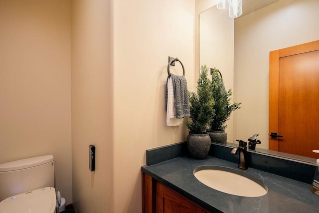 bathroom with toilet and vanity