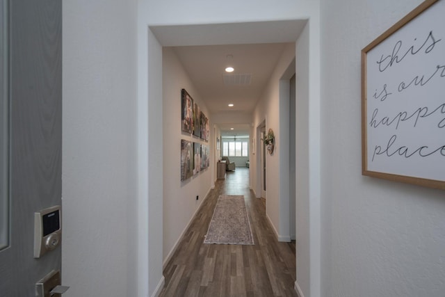 corridor with recessed lighting, wood finished floors, visible vents, and baseboards