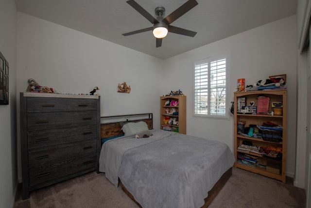 bedroom with light colored carpet and ceiling fan