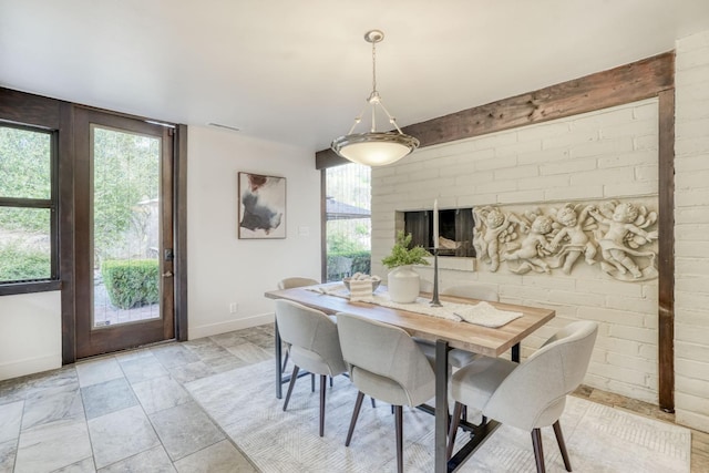 dining area featuring baseboards