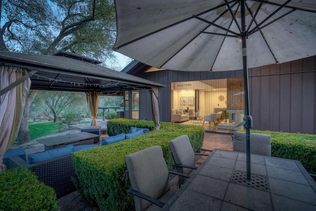 view of patio / terrace featuring outdoor lounge area, outdoor dining area, and a gazebo