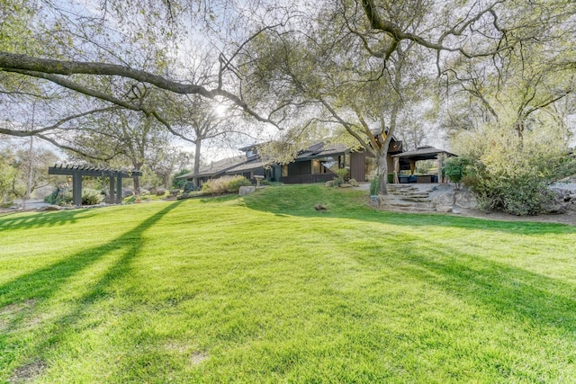 view of yard with a pergola