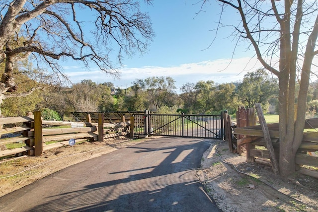 view of gate featuring fence