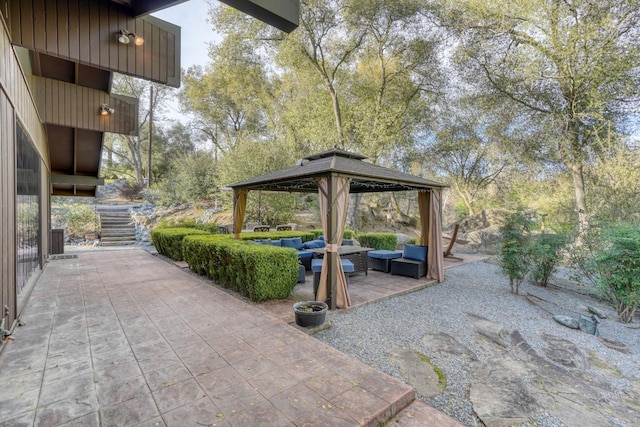 view of patio / terrace with an outdoor living space and a gazebo