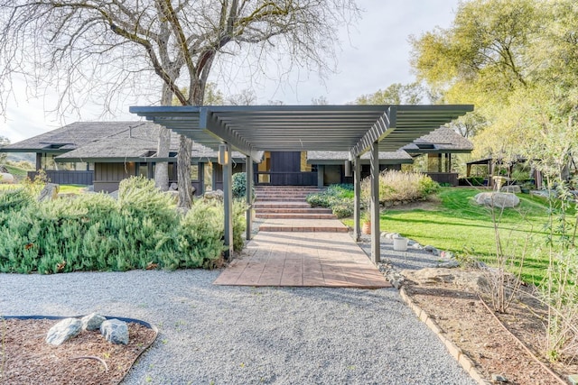 view of front of property with a pergola