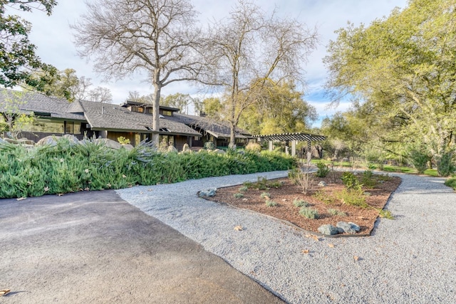 view of home's community featuring a pergola