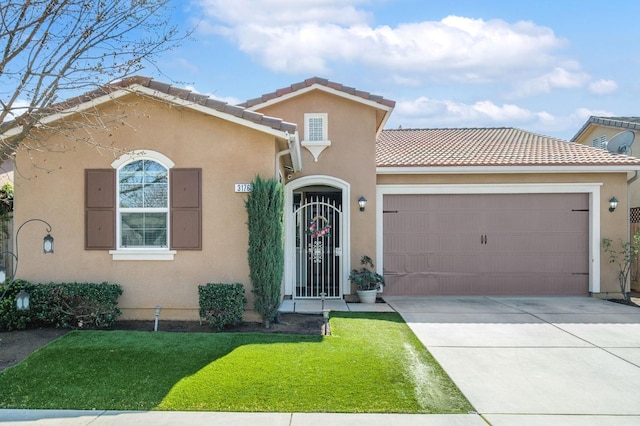 mediterranean / spanish-style home with a garage, driveway, a tile roof, and stucco siding