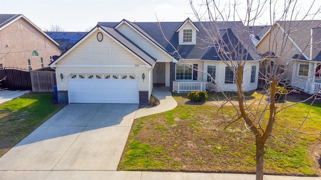 15877 W C St, Kerman, CA 93630 - view of front facade with concrete driveway, an attached garage, and brick siding