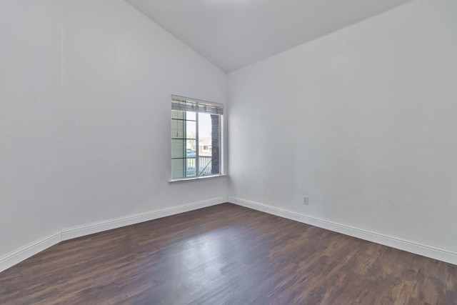 15877 W C St, Kerman, CA 93630 - spare room featuring dark wood-style flooring and high vaulted ceiling