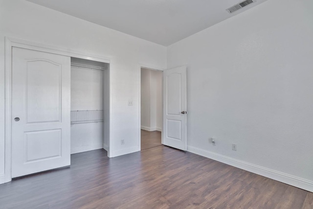 15877 W C St, Kerman, CA 93630 - unfurnished bedroom featuring dark wood finished floors and a closet
