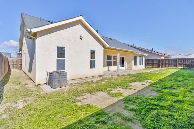 15877 W C St, Kerman, CA 93630 - back of house with a fenced backyard, stucco siding, and a patio area