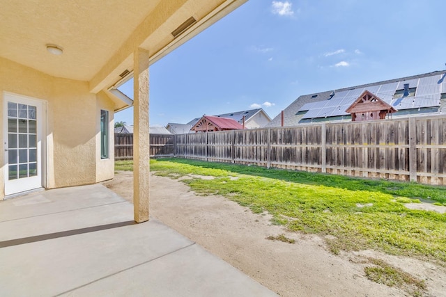 15877 W C St, Kerman, CA 93630 - fenced backyard with a patio area and a residential view