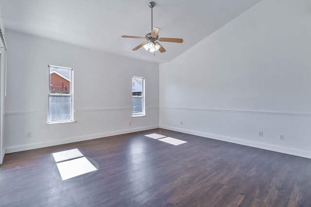 15877 W C St, Kerman, CA 93630 - spare room with a ceiling fan, dark wood-style floors, and vaulted ceiling