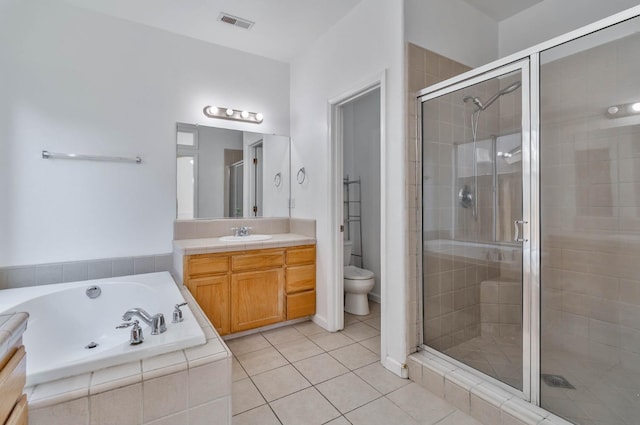 15877 W C St, Kerman, CA 93630 - bathroom featuring vanity, a shower stall, a garden tub, and tile patterned flooring
