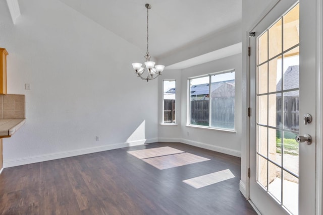 15877 W C St, Kerman, CA 93630 - unfurnished dining area featuring a chandelier, dark wood finished floors, and vaulted ceiling