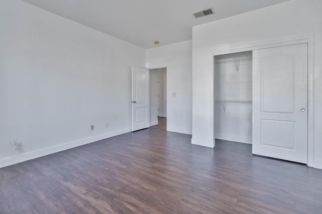 15877 W C St, Kerman, CA 93630 - unfurnished bedroom featuring dark wood finished floors and a closet