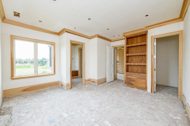 interior space featuring baseboards and ornamental molding