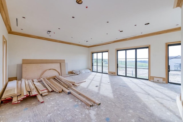 unfurnished bedroom featuring access to outside, baseboards, and ornamental molding