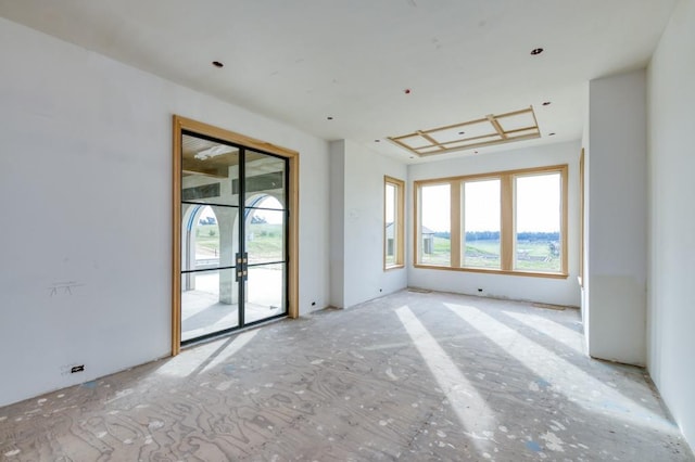 spare room featuring french doors