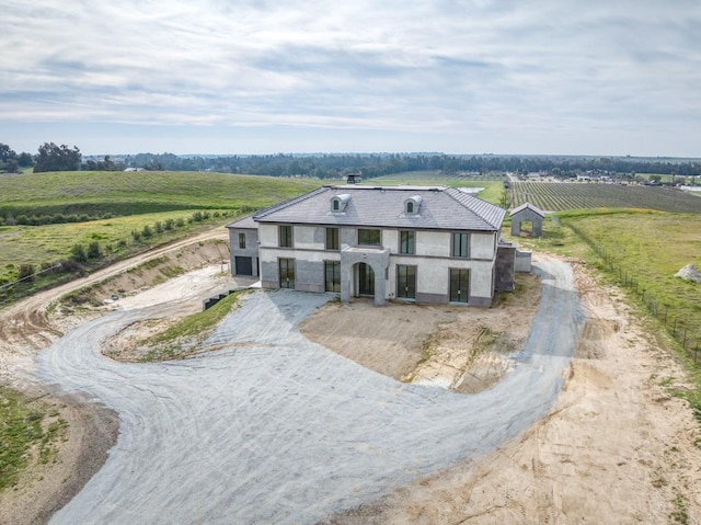 view of front facade with a rural view and driveway