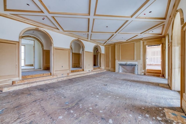 unfurnished living room featuring coffered ceiling