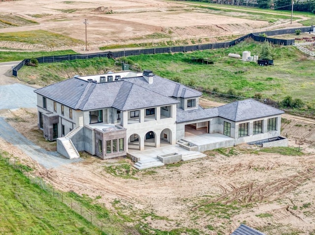 birds eye view of property with a rural view