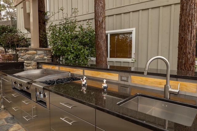 39118 Lake Dr, Bass Lake, CA 93604 - kitchen with stainless steel stovetop and dark stone countertops