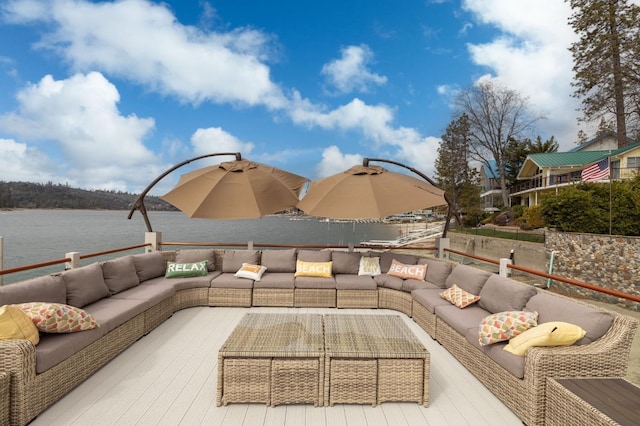39118 Lake Dr, Bass Lake, CA 93604 - view of patio with outdoor lounge area and a deck with water view