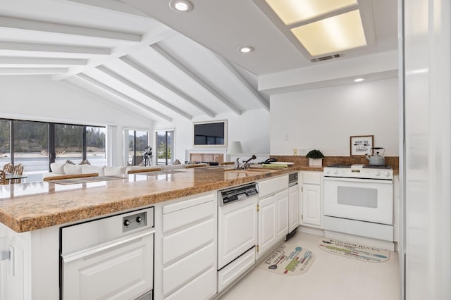 39118 Lake Dr, Bass Lake, CA 93604 - kitchen featuring white appliances, a peninsula, recessed lighting, white cabinets, and open floor plan
