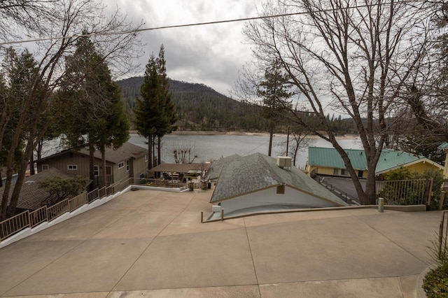39118 Lake Dr, Bass Lake, CA 93604 - view of patio / terrace with a water and mountain view