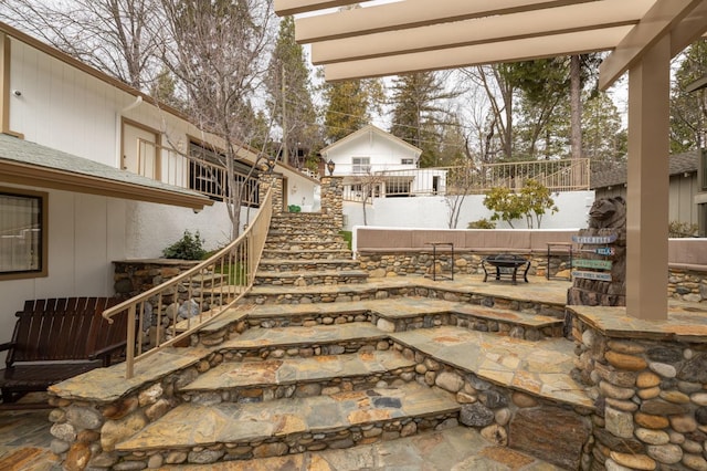 39118 Lake Dr, Bass Lake, CA 93604 - view of patio / terrace with stairway and a fire pit
