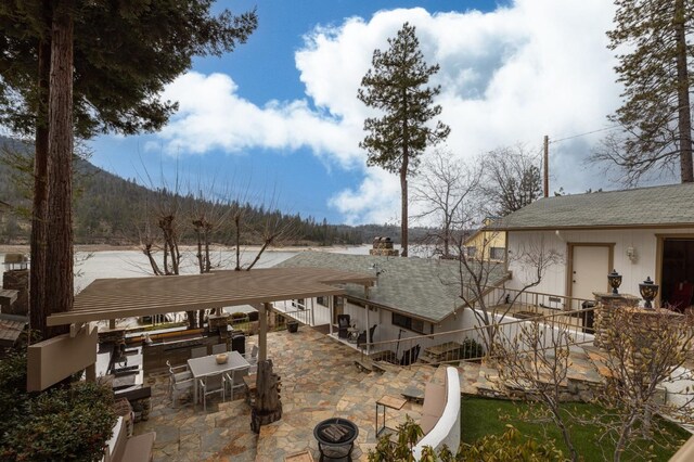 39118 Lake Dr, Bass Lake, CA 93604 - view of yard featuring a patio area and exterior kitchen