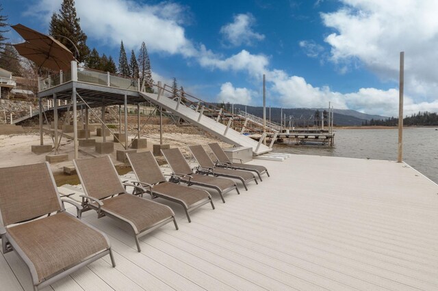 39118 Lake Dr, Bass Lake, CA 93604 - view of pool featuring a floating dock, a water view, and stairs