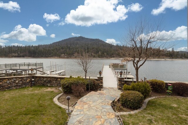 39118 Lake Dr, Bass Lake, CA 93604 - dock with a wooded view, a water and mountain view, and a lawn