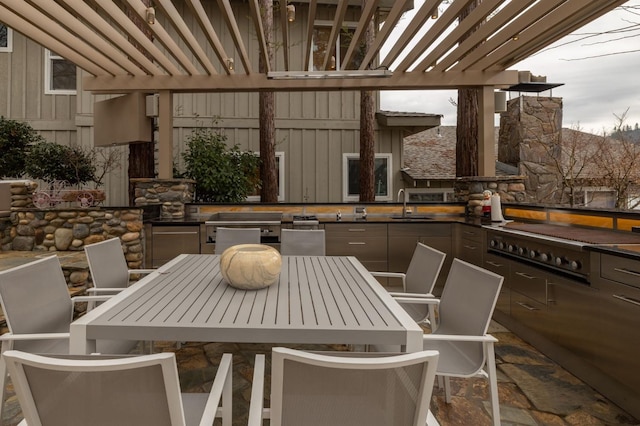 39118 Lake Dr, Bass Lake, CA 93604 - view of patio / terrace featuring outdoor dining area, exterior kitchen, and a pergola
