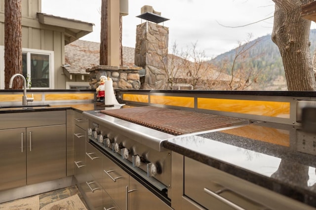 39118 Lake Dr, Bass Lake, CA 93604 - kitchen view of gray cabinets and stainless steel gas stovetop