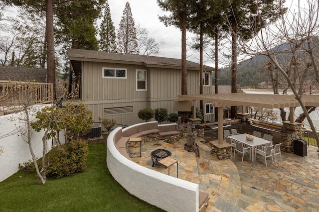 39118 Lake Dr, Bass Lake, CA 93604 - view of patio featuring a fire pit