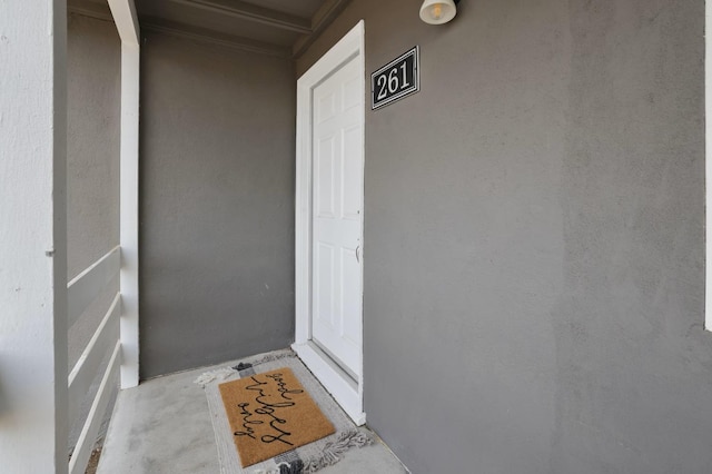 entrance to property with stucco siding