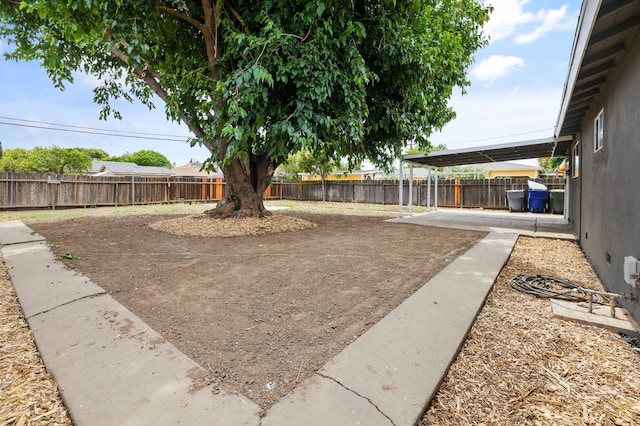 view of yard with a fenced backyard and a patio