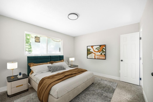 bedroom featuring carpet flooring and baseboards